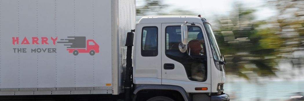 10 Questions That Every Client Should Ask Removalist Company 1 Harry The Mover's moving truck in Melbourne on the road, ensuring safe and reliable transportation for a seamless relocation experience.